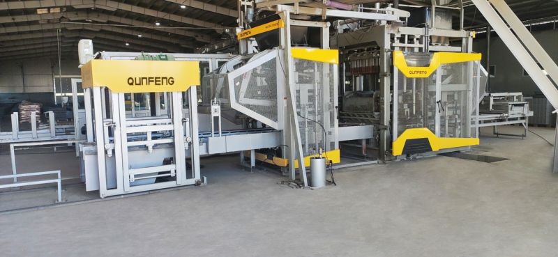 the QS1300-H intelligent block machine of the Romania high-elevation, ultra-thin riverbank block production l a máquina de bloco inteligente QS1300-H da produção de blocos ultrafinos e de alta elevação nas margens do rio na Romênia l