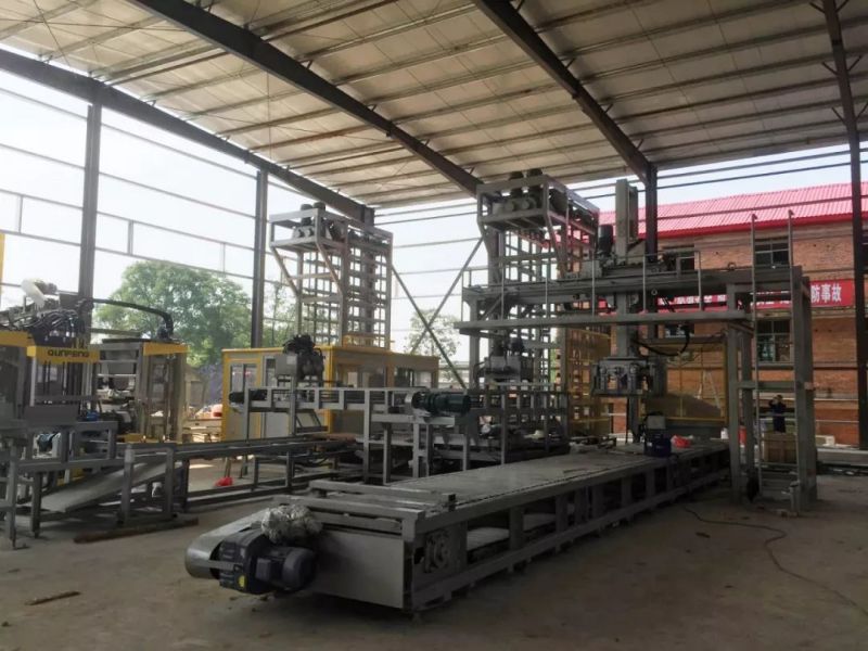 the palletizing system of the pavement block production line in Hunan o sistema de paletização da linha de produção de blocos de pavimento em Hunan